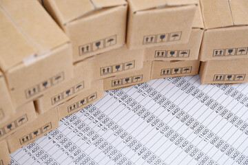 Cargo and logistics business concept. Many carton boxes on financial documents.	