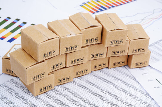 Many carton boxes on financial documents, charts and graphs.