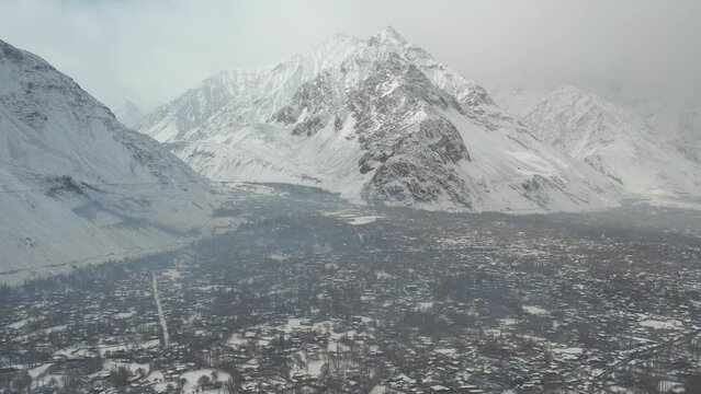 Drone shot of mountains of Skardu with city at foreground in Pakistan.
