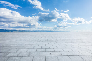 Empty square floor and mountains with sky clouds nature background
