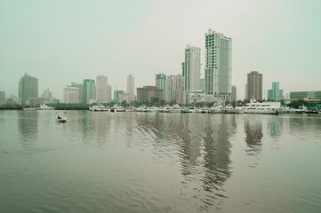 Calm waters of the sea with the buildings of Manila City of the Philippines in the background