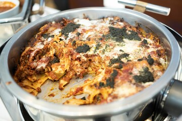 Closeup shot of a tasty Gratin with meat and pasta served ad a cafeteria