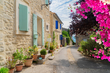 view of beautiful old town street with stairs of Provence at summer day, France