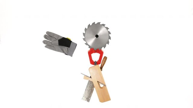 Stop Motion footage of hands making a funny craftsman creatively out of tools, isolated on white. A fun concept for workers
