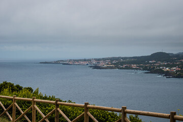Obraz premium Viewpoint with wooden fence in Monte Brasil to São Mateus and Atlantic Ocean, Terceira - Azores PORTUGAL