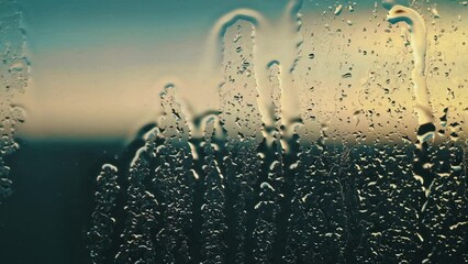 Droplets speckle the glass in the cool, serene twilight, reflecting the subtle interplay of light and water - Powered by Adobe