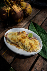 Beautiful shot of a tasty meal with meat and covered with cheese