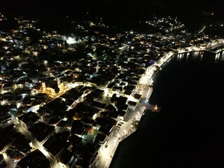 Beautiful aerial view of a coastal town at night