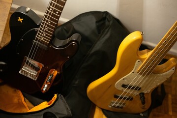 Fototapeta na wymiar Closeup of yellow and brown electric guitars in the room