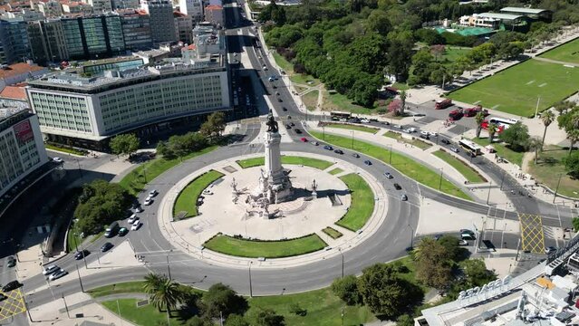 Aerial hyper lapse footage of cars driving at the Marques de Pombal square