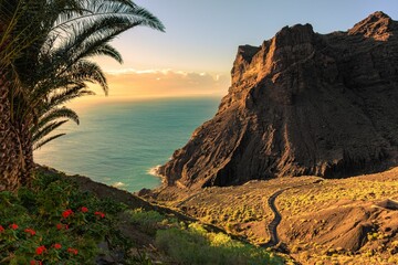 Scenic view of a landscape with tropical nature and geological formations at sunset