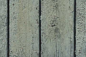 Background texture wooden old facade on a house, cracked paint.