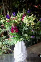 Flowers, bouquet, composition of beautiful fresh flowers with white, purple, pink, red and rose and a beautiful modern white vase