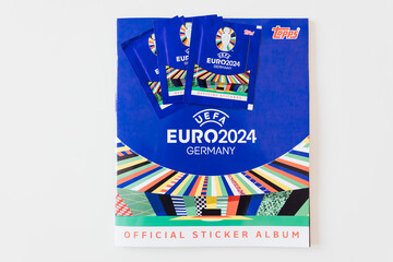 Naklejka premium BERLIN, GERMANY - APR 6, 2024: Trading cards by Topps collectors sticker album for UEFA EURO football championship in 2024 taking place in Germany, Europe.