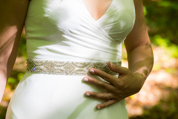 Detail of the hand and the ring of a newlywed bride in spring forest in La Fageda d en Jorda, La...