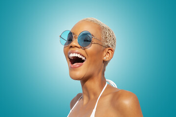 Fashion Happy laughing woman portrait wearing blue polarized sunglasses, isolated on turquoise bright background. Advertisement banner for summer beach holiday and shopping online