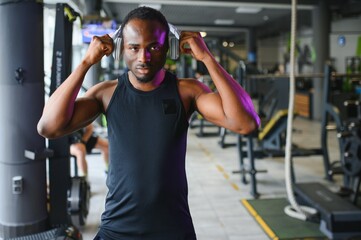 Young African-American man in a gym preparing to exercise