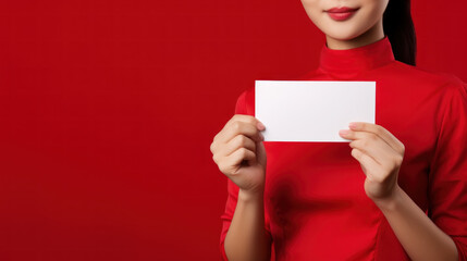 asian waiter woman on red background hold white paper