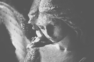 Angel as a guardian of human beings. close up black and white image.