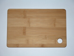 Cutting Board for Products. Wooden. Through hole. On an isolated white background.	