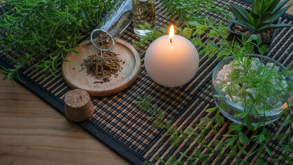 lit candle with spa decoration objects. relaxation time.