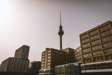 Neighborhoods of East Berlin with a TV tower in the center. - obrazy, fototapety, plakaty