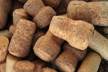 Pile of natural wooden wine corks close up as background. Concept of environmental protection and...