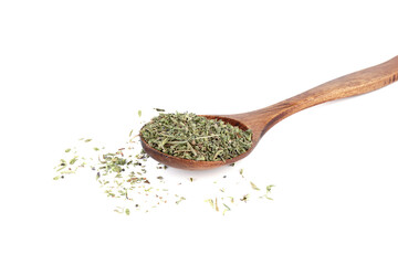 Dried thyme herb on wooden spoon and on white background.
