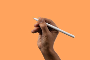 Black male hand holding an smart pencil isolated on orange banner.