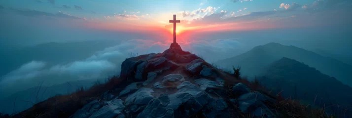 Fotobehang Crucifix at the Top of a Mountain with Sunlight, Serene sunrise behind a cross on a mountain symbol of hope and faith beautiful landscape with warm light panoramic scenery in a peaceful © sanjaykhan