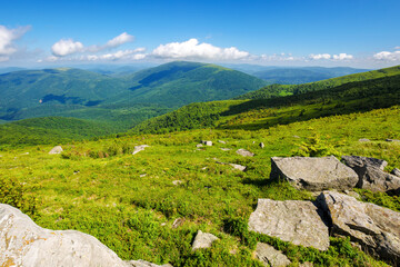 green alpine hills and meadow of carpathians. stones among the grass beneath a sky with clouds. summer vacations in ukrainian mountains - 779649026