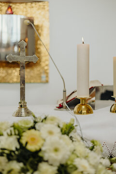 candles, cross and flowers in the church