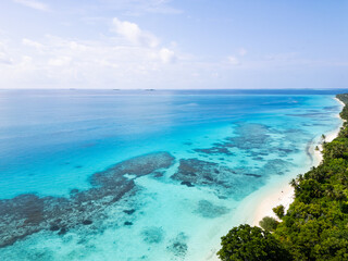 Aerial view of the Dhigurah island in the Maldives famous for its long white sand beach lined with...