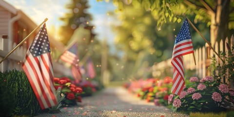 A row of American flags are displayed in a garden. The flags are red, white, and blue, and they are arranged in a row. The garden is filled with red flowers, creating a patriotic