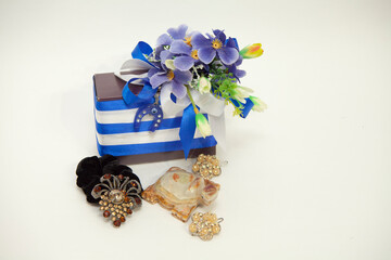 Gift box. celebration concept decorated with flowers. in white and blue colors. Souvenir turtle for...