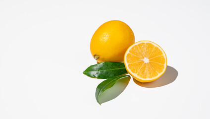 Fresh cut lemons on isolated white background with shadow and leaves