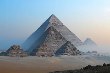 Foto op Canvas The iconic Pyramids of Giza stand tall amidst the fog in the desert, creating an enigmatic and atmospheric scene, A pyramid complex in Egypt at dawn, AI Generated © Ifti Digital