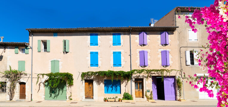 Fototapeta beautiful old town street, houses with colorful shutters in Provence , France