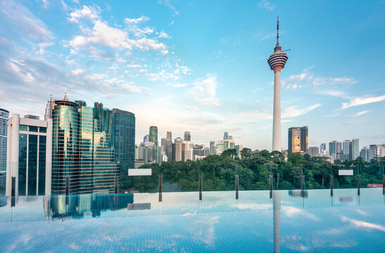 Fototapeta Kuala Lumpur cityscape,with KL Tower,viewed from rooftop swimming pool,Malaysia.