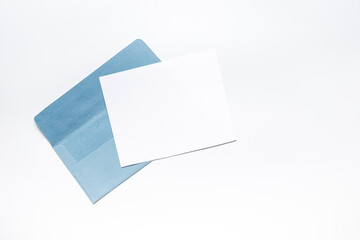 Blank sheet of paper on an envelope for letters. Space for text, top view