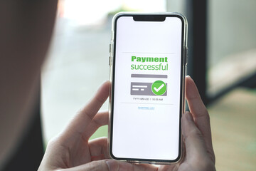 Online financial transactions and payment successful. Close-up of hand using smartphone for payment of shopping transaction By credit card online banking