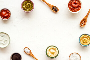 Bowls with various sauces and chili pepper with spices. Food background
