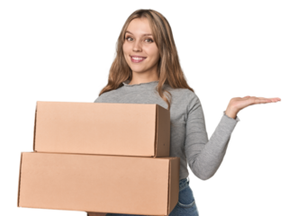 Blonde woman with cardboard boxes moving on studio backdrop showing a copy space on a palm and holding another hand on waist.