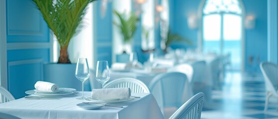 The indoor restaurant features a bright blue table arrangement that exudes a Mediterranean flavour.