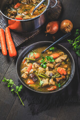 Homemade meat and vegetable stew or soup with mushrooms