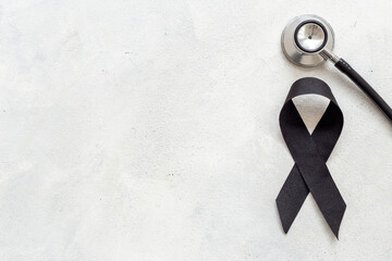 Black silk ribbon symbol of mourning and tragedy - 779681823