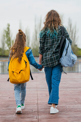 A teenage girl who goes to school with her little brother.