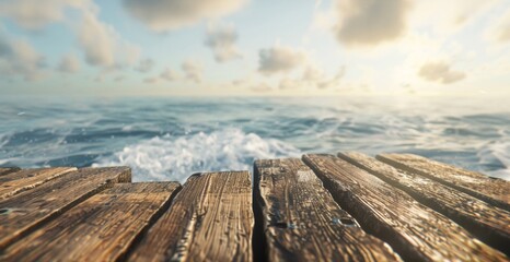 Old wooden planks of a pier lead into a tranquil ocean against a backdrop of a cloudy sky.