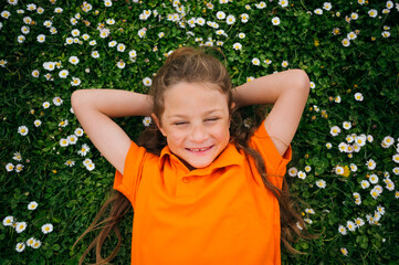 A child lying happy in the garden.