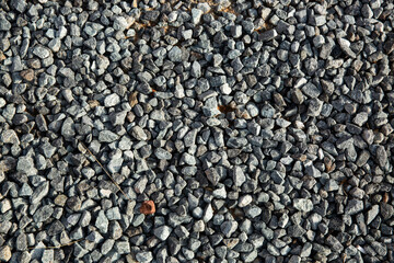 Crushed rock close up. Small rocks ground.